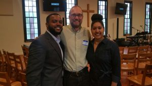 Pastor Cleve May of CityWell Church greets NCCU Wesley Fellows, Winston Holloway & Lyndsey Jones during morning worship service.
